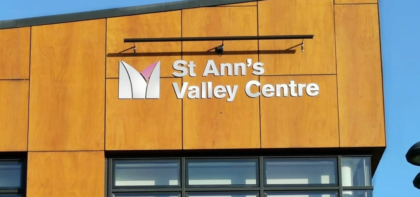 Golden-brown frontage and sign of St Ann’s Valley Centre, home to St Ann’s Valley Library.