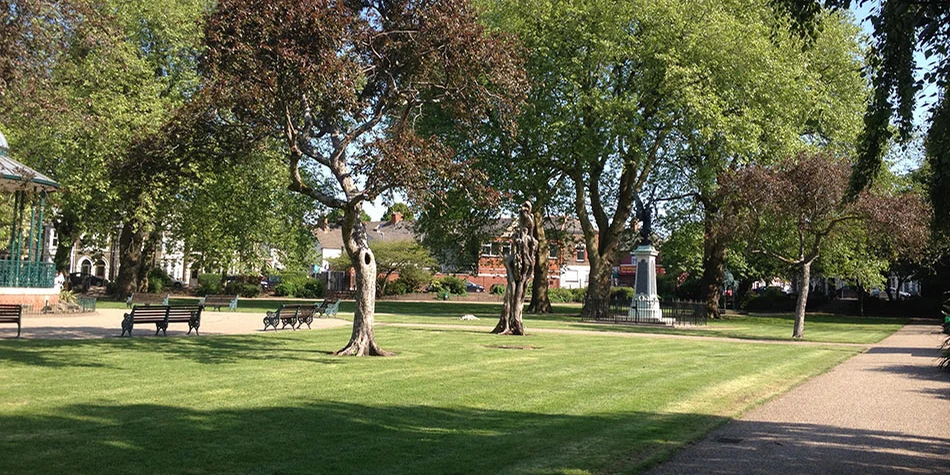 Lawns, paths, benches and trees in Grange Gardens, Grangetown, Cardiff.