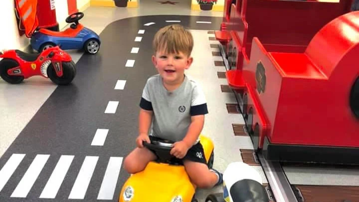 Ride-on cars and a red play train at Little Street West Byfleet