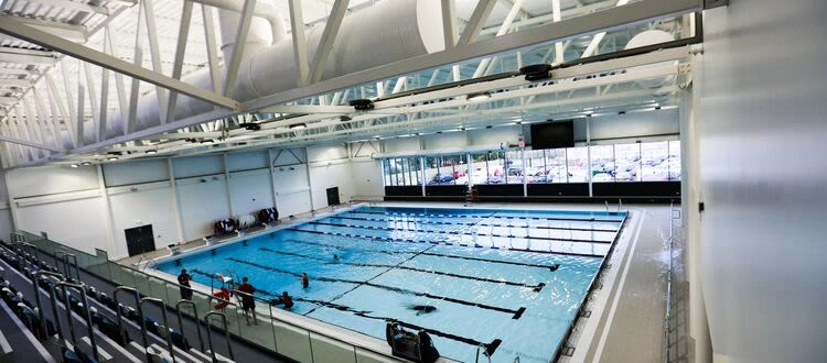 The lane-marked main pool at Lisnasharragh Leisure Centre, viewed from the spectator gallery