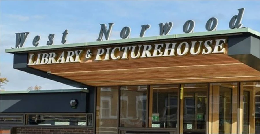 Entrance canopy and West Norwood Library & Picturehouse sign above the glass doors