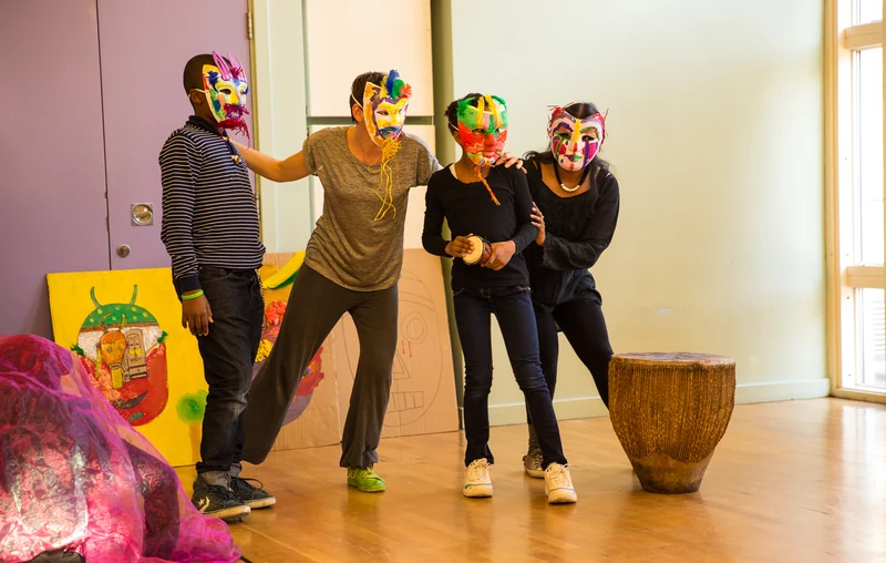 Participants wearing colourful handmade masks in a historical Demonstrate! session, 2016–19
