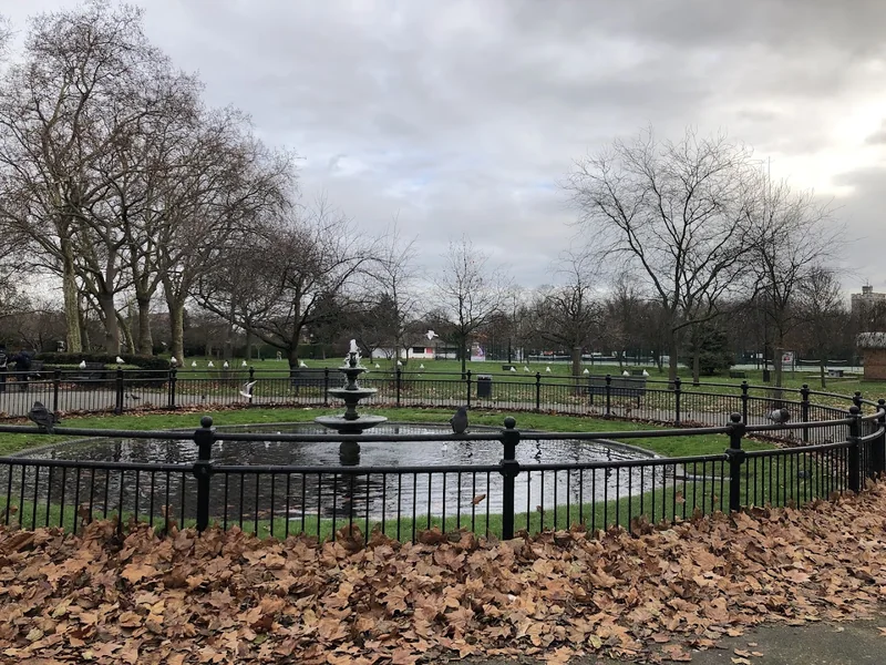 Fountain pond and railings in Stratford Park