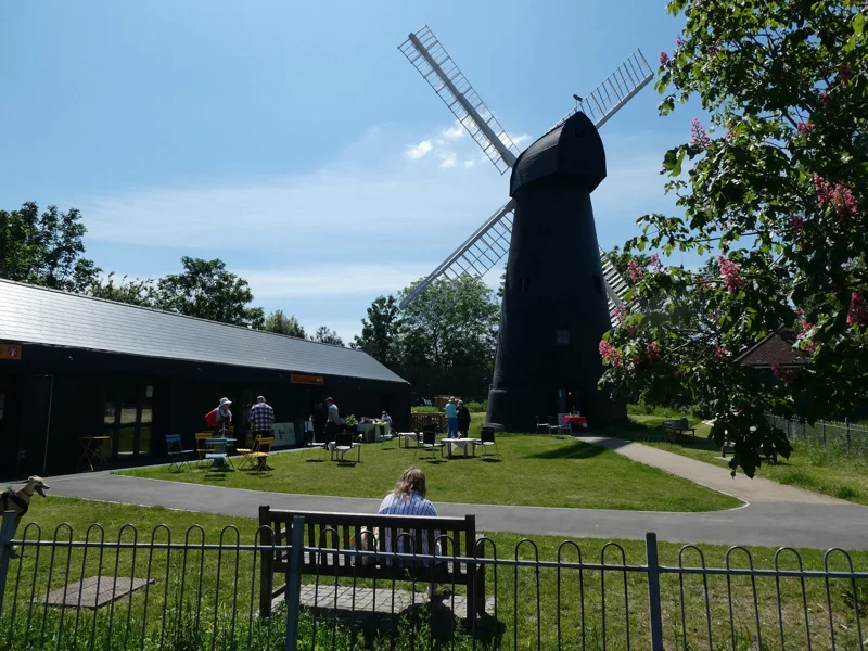 Brixton Windmill beside the education centre and garden tables